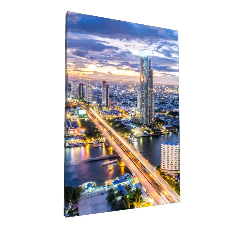 Tablou canvas: Panoramă Urbană la Apus cu Râul Luminos